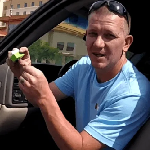 a man holding Fuel Save Pro