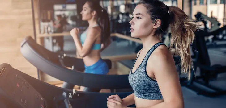 a young woman working out at the gym using iductivv