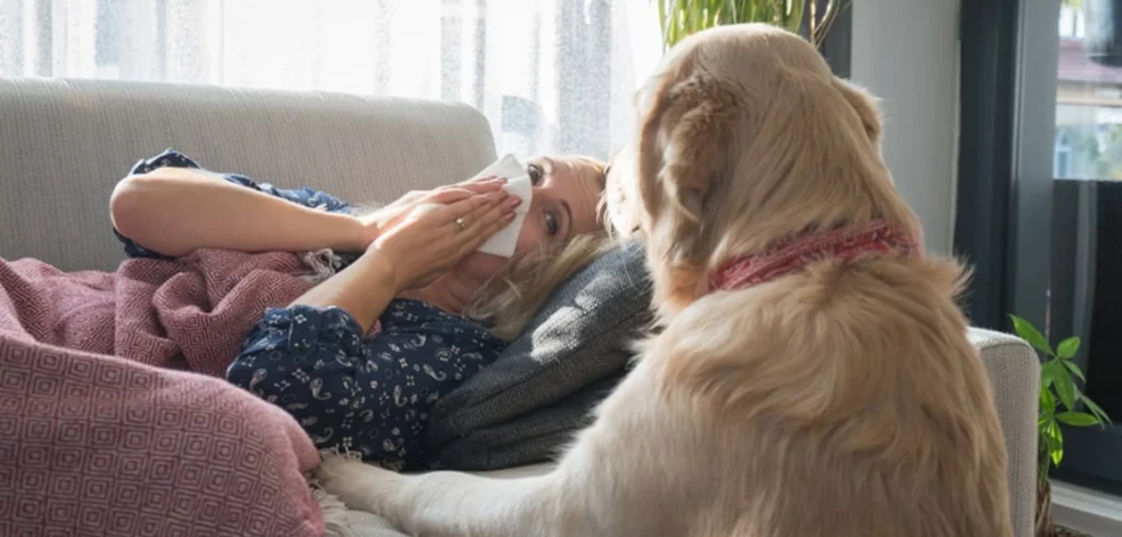 Blast Auxiliary Premium HEPA Air Cleaner lady suffering from pet allergies on couch